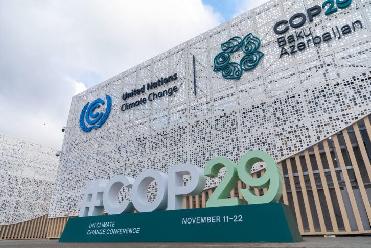 COP29 signs in front of the venue in Baku, with logo of United Nations Climate Change