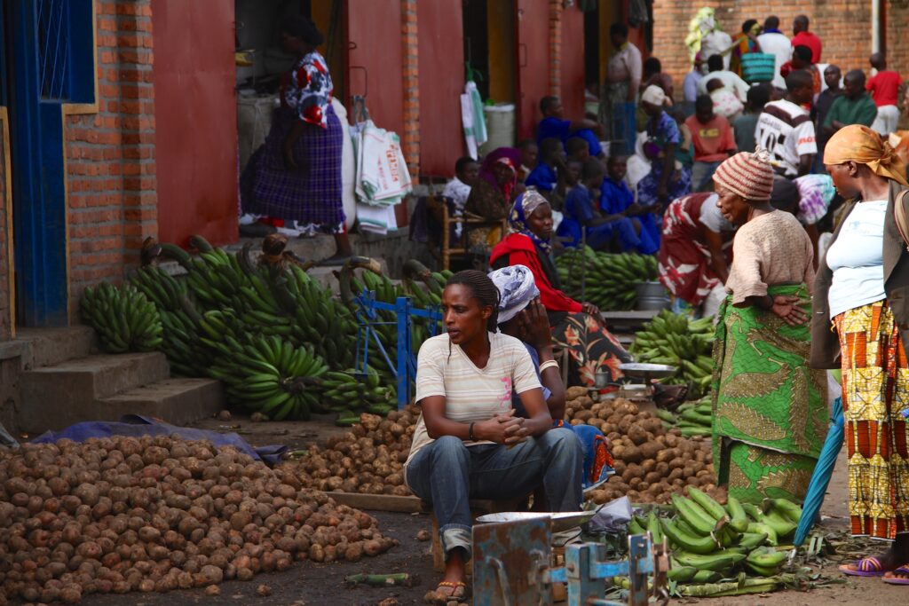 cover photo of the article about healing in Rwanda, showin the woman at the market in Musanze