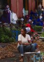 cover photo of the article about healing in Rwanda, showin the woman at the market in Musanze